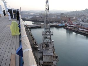 The BAE Systems crane in San Francisco moving containers and equipment.