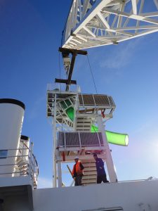 Carnival Spirit water slide being lifted on deck.