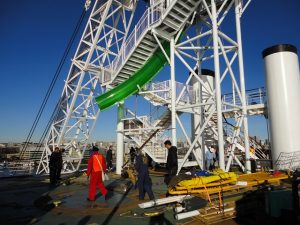 Carnival Spirit water slide being lowered on deck.