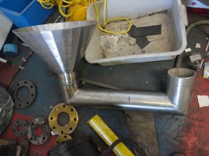 Stainless steel funnel welded to pipe with a flange