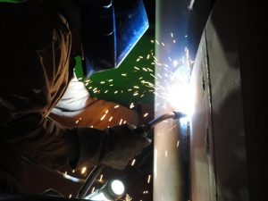 Welding vertical up with FCAW using a E71-T electrode and shielding gas or dual shield.